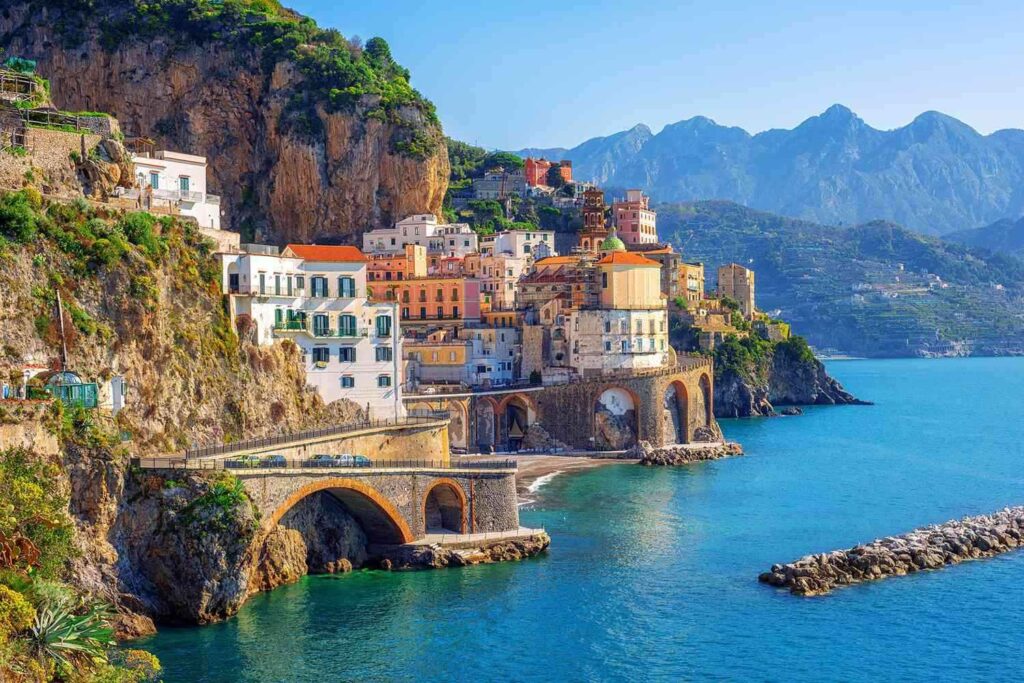 The captivating view of Positano's cascading pastel houses and the azure Mediterranean Sea.